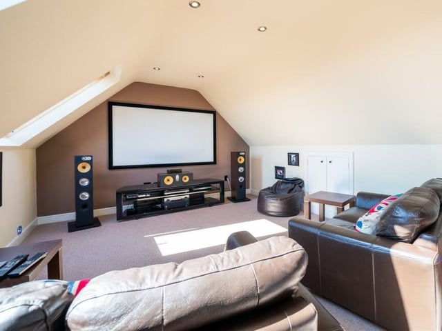 The other half of the ingenious loft-conversion is this spectacular cinema room. Quite a place to escape to so you can catch up on the latest movies. It's a flexible space too, so it can easily be turned back into the property's fifth bedroom if required.