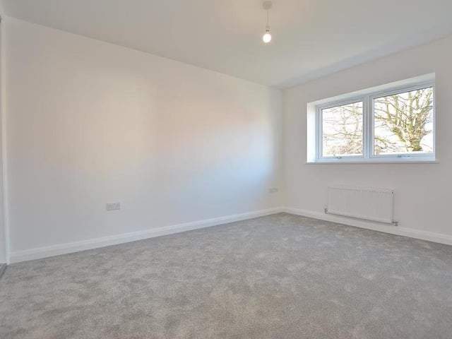 The first bedroom is the largest, and promises to be as warm and cosy as you can make it. Two double-glazed windows face the side of the bungalow, while there are also four double power points, a TV point and a radiator.