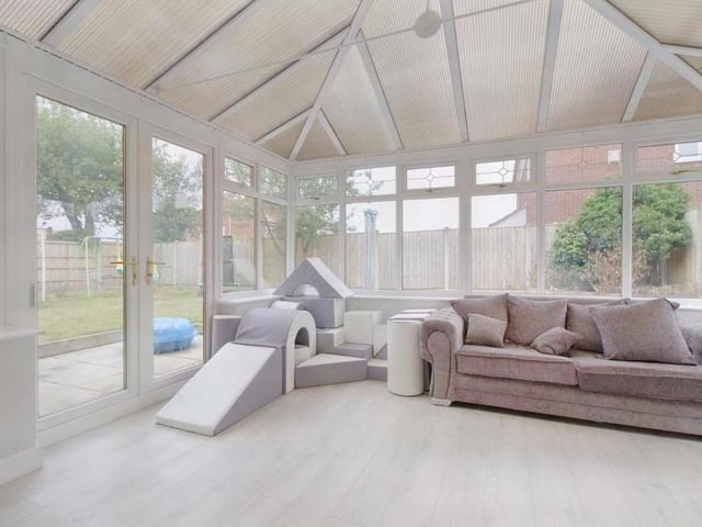 The spacious and light-filled conservatory is the perfect space for entertaining family and friends. Open the front doors to take in the delights of the garden.