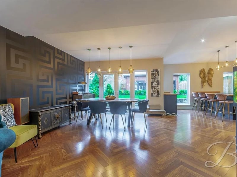 Incredible open-plan space with parquet flooring, ample dining space, underfloor heating, and French doors leading out to the rear garden.