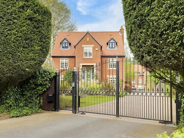 One last lingering look through the gates of the £950,000 Ravenshead house. As well as the driveway, the front comprises a lawned garden, with decorative plants, shrubs and hedged borders, plus outdoor lighting.