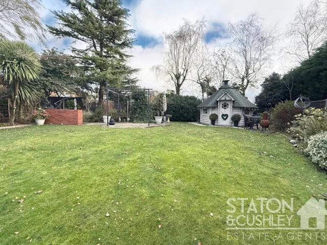 The rear garden is a true showstopper - an expansive outdoor haven thoughtfully zoned to create multiple areas for entertaining, relaxing, and enjoying outdoor living.