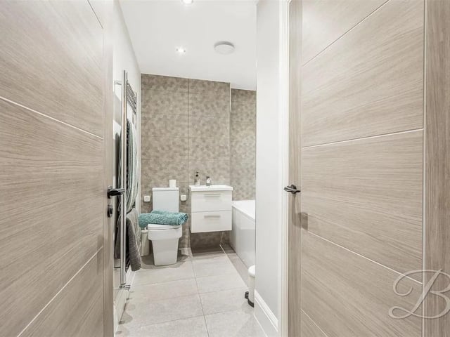 The bathroom is complete with a three piece suite including a bath, low flush WC and hand wash basin. With a window to the side elevation.