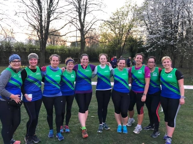 One of the former Mansfield Harriers ladies' team gather for a team picture before a race.