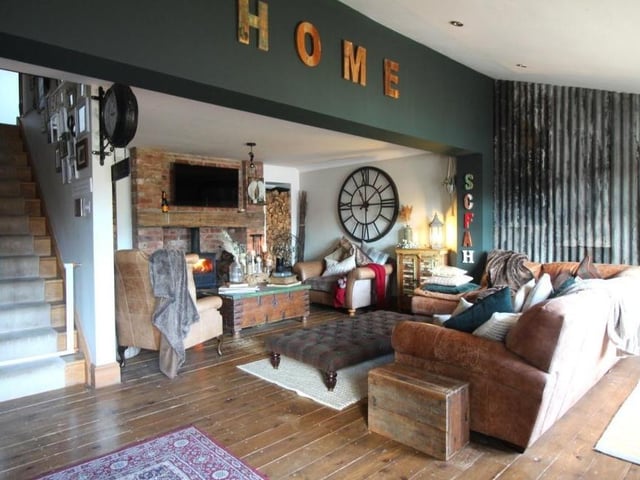 No wonder this is a place they call home. The striking lounge is the perfect room to start our photo tour of the Swingate property. Features include a solid wood entrance door, exposed wooden flooring, stairs to the first floor, ceiling spotlights and four radiator.