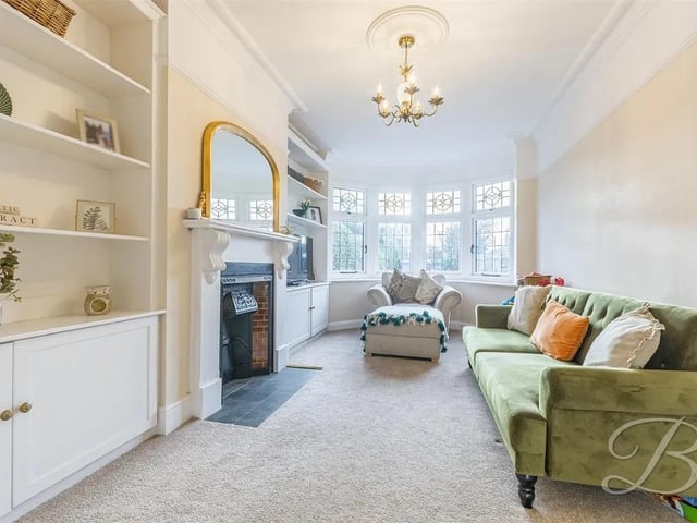The lounge has carpeted flooring, feature fireplace and bay window to front elevation.