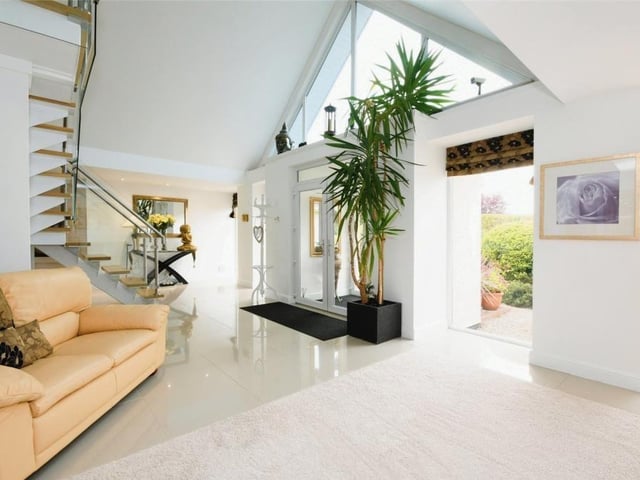 Let's start our tour of the Lichfield Lane property in the huge reception hall, which is truly a sight to behold, particularly with its apex window facing the front of the building. Its porcelain floor adds sparkle and style too.