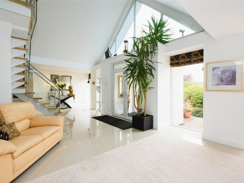 Let's start our tour of the Lichfield Lane property in the huge reception hall, which is truly a sight to behold, particularly with its apex window facing the front of the building. Its porcelain floor adds sparkle and style too.