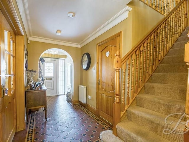 Time now to go upstairs, so let's pass through the warm and inviting entrance hallway, which is very well presented.