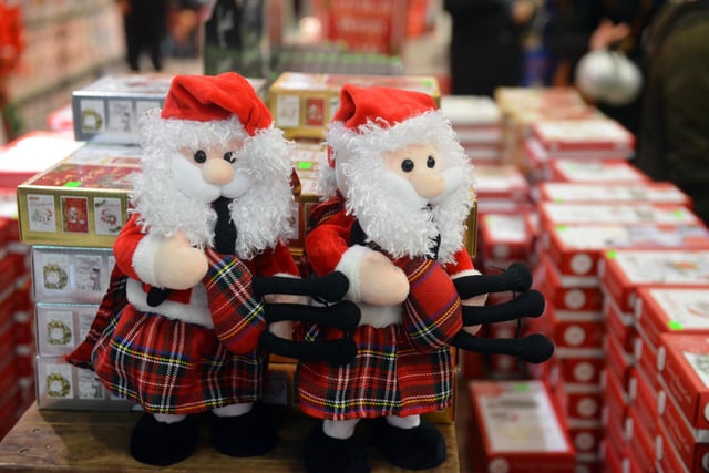 Mini Santa's in kilts are spreading Christmas cheer. Let's hope this Santa has underwear on!
