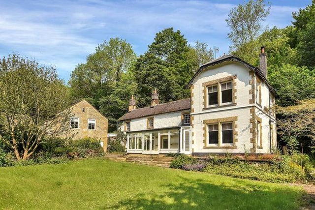 This four bedroom house on the banks of the River Lathkill is in need of renovation, but has a breakfast kitchen and extensive gardens and grounds. Marketed by Fisher German, 01530 658941.