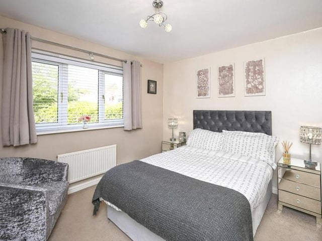 Delightful decor makes the third bedroom stand out. You can gaze at the back garden from its window.