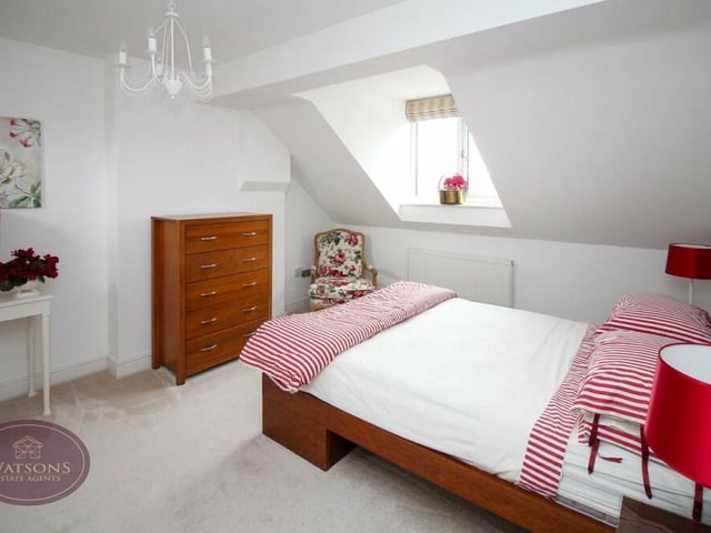 This cosy bedroom is a relaxing retreat, with a window overlooking the front of the house.