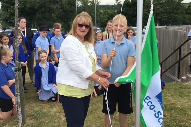 The school raised the Green Flag in memory of late school governor Kevin Evans.