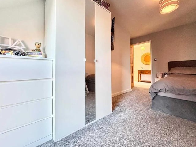 One of four bedrooms in the spacious property, providing ample space for a family.