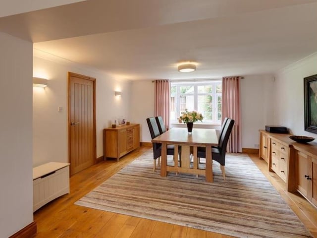 The dining room at the Heath property is a lovely space for family meals. Facing the back of the house, it boasts an oak wood floor, coved ceiling, flush light point, wall-mounted light points, TV/aerial point and telephone point. An oak door opens to the inner hall.