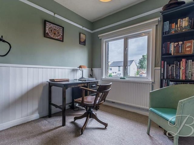 This bedroom is on the compact side, but could easily be turned into a home office or study.