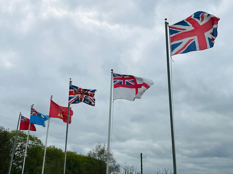 Flags line the A60 as part of the VE Day display.