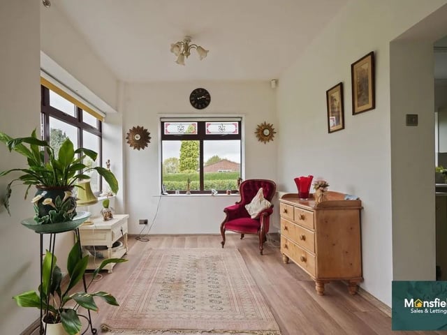 A separate dining room and an additional reception room provide excellent flexibility, with garden views flooding the space with natural light.