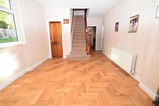 The rear hall has its own entrance from the driveway, meaning this part of the house could well be split off as an annexe. The stairs lead to two of the bedrooms on the first floor. The hall's floor is solid wood, and there is a useful cupboard beneath the staircase.