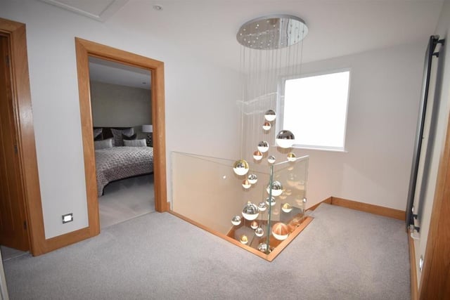 At the top of the stairs, you are greeted by this spacious landing, which leads to all four bedrooms and the family bathroom. It boasts a useful storage cupboard and access to a loft.