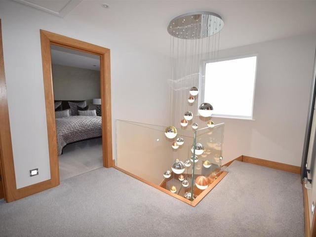 At the top of the stairs, you are greeted by this spacious landing, which leads to all four bedrooms and the family bathroom. It boasts a useful storage cupboard and access to a loft.