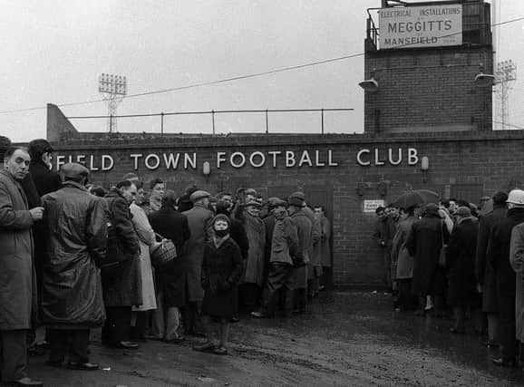 Fans queue to get into the ground in 1962.