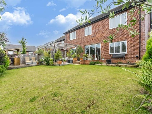 Here is a full view of the rear of the house from the garden lawn. You can see the bi-folding doors that lead from the dining area of the open-plan space on the ground floor.