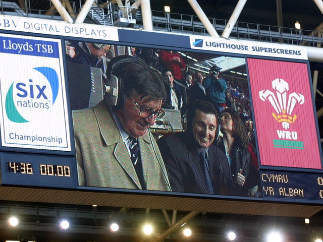 Bill McLaren's image is projected on to the big screen while commentating on the final international match of his remarkable career. The crowd sang "For He's a Jolly Good Fellow" and one Welsh supporter displayed a banner claiming "Bill McLaren is Welsh".