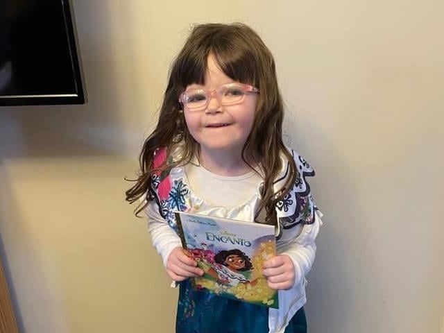 Nevaeh, age 5, is dressed as Mirabel from Encanto.