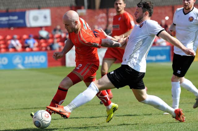 Action involving Alfreton Town, who lost 4-2 at home to Brackley Town.