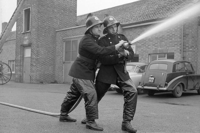Nottinghamshire firefighters in 1965. These two firefighters are believed to be Loz Brooks and Mick Phillips at Mansfield Fire Station.