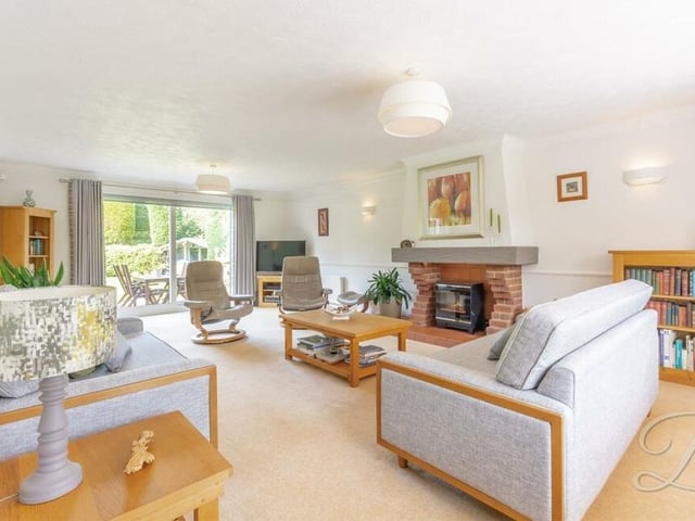 Let's begin our tour of the £775,000-plus Mansfield property in the lounge, which is large but plenty cosy enough. Assets are a feature fireplace and sliding doors that lead out to the back garden.