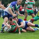 Peter Aldred powers through to score a try for Wolf Hunt  - Pic by: Richard Parkes
