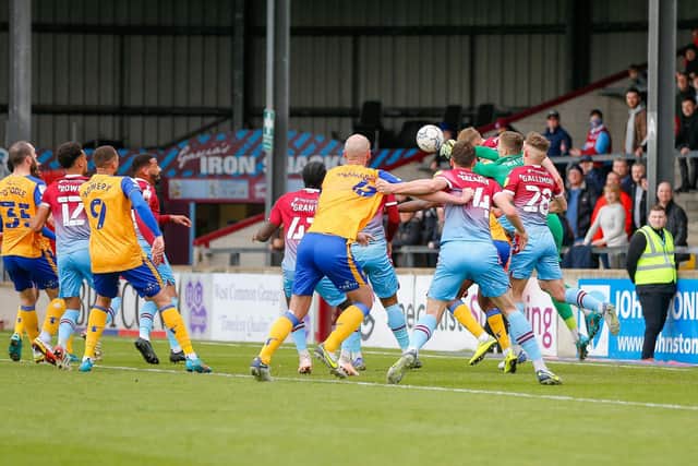 Scunthorpe keeper Rory Watson punches clear against the Stags on Saturday. Photo by Chris Holloway/The Bigger Picture.media