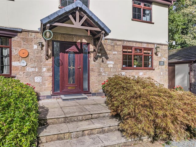 The unique character of the £535,000 property is summed up by the front entrance, with steps leading to the door of Four Oaks.