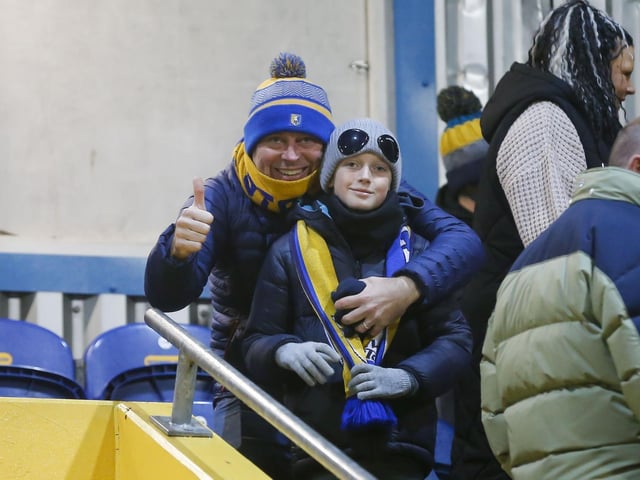 during the Sky Bet League 2 match against Sutton Utd at the One Call Stadium, 23 Jan 2024, Photo credit Chris & Jeanette Holloway / The Bigger Picture.media:Mansfield Town fans at last night's draw with Sutton United.