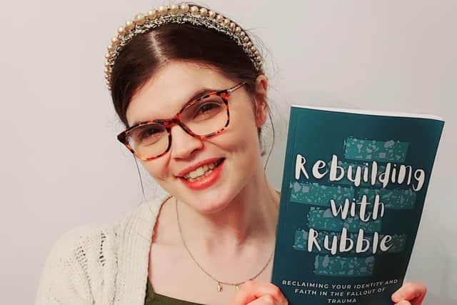 Mansfield Woodhouse mum Kathryn Hill, 35, with her new book, 'Rebuilding With Rubble', which tells of her fightback from the trauma of childhood sexual abuse.