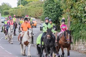 Riders wend their way through Blidworth during the awareness horse-ride held on Sunday. (PHOTO BY: Epona Photography)