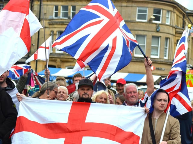 Many people joined the demonstration, waving national flags to express their support for their country.