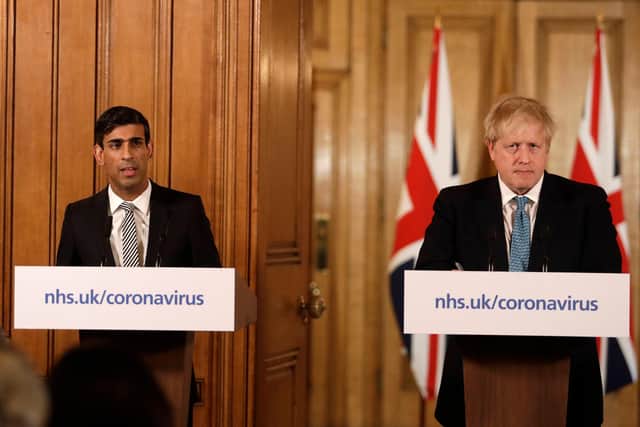 Chancellor Rishi Sunak with Prime Minister Boris Johnson at a media briefing in Downing Street, London, on Coronavirus (COVID-19). Matt Dunham/PA Wire