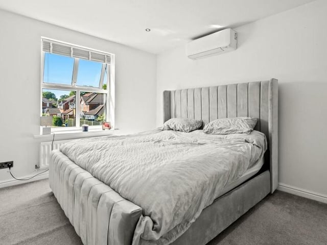 We're upstairs now at the £375,000 Mansfield Woodhouse property, and here is the primary bedroom, which is a sizeable double that has access to an en suite bathroom.