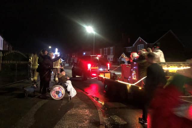 Residents cheered on Santa's sleigh as he made his way around the village.
