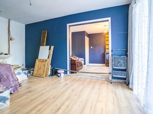 This spacious bedroom, with an extension, has French doors overlooking the front of the Selston bungalow.