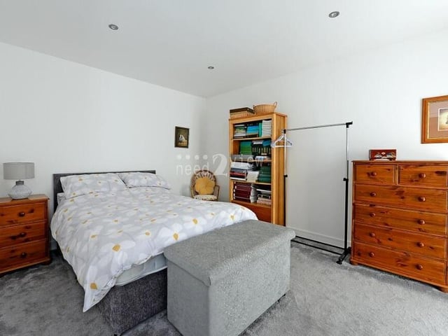 The next bedroom at the £450,000 Forest Town bungalow is an attractive double and the same, good size as number two. It faces the back of the property and boasts a soft, grey carpet