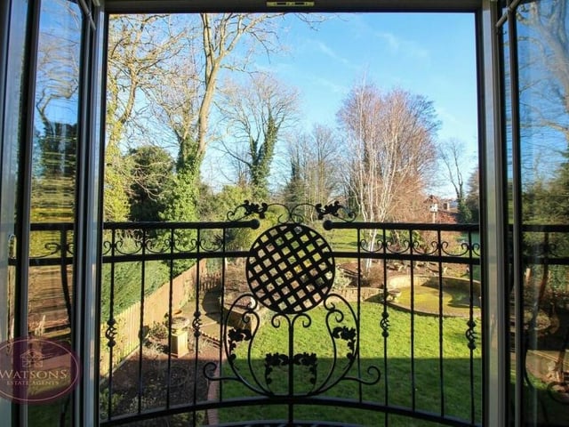 A close-up of the French doors that swing open and take you on to the Juliet balcony in the second bedroom.