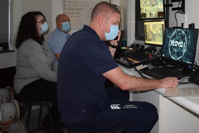 Staff monitor the exercise from the control assessment room.