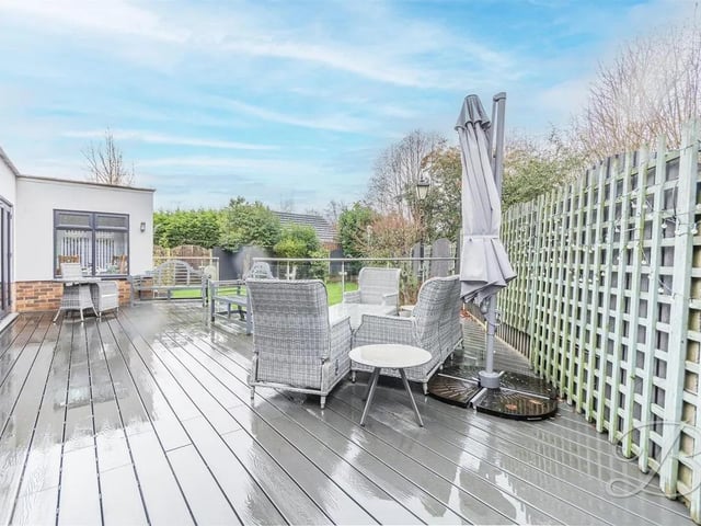 A surrounding decking area in the garden creates an ideal setting for entertaining or relaxing.