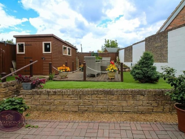 The back garden at the Little Lane bungalow includes a timber-built shed.