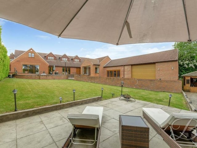 Here's a close-up of the patio and seating area in the garden of the £750,000 Huthwaite property.